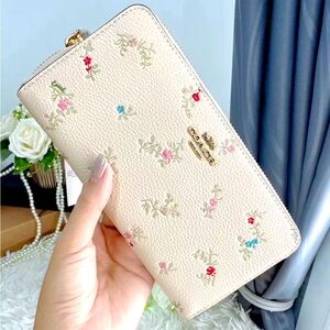 Coach antique floral print leather accordion zip wallet